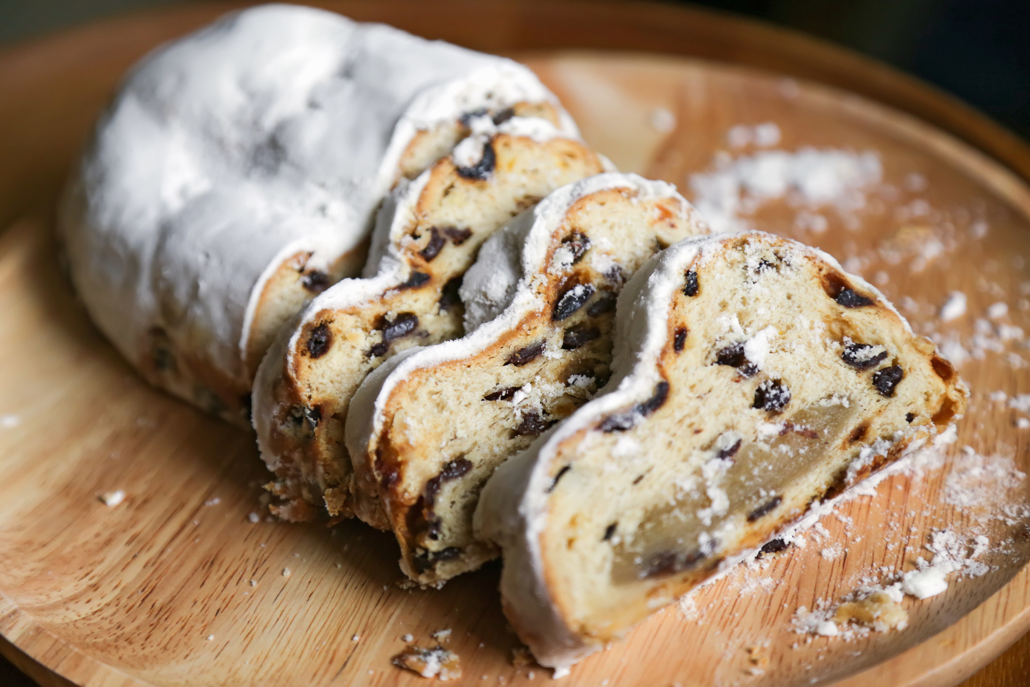 fruit bread of nuts, spices, and dried or candied fruit, coated with powdered sugar or icing sugar