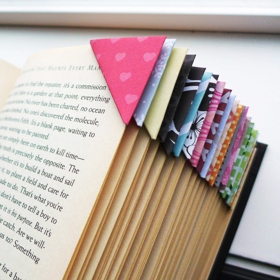 colorful printed corner bookmarks on pages throughout book