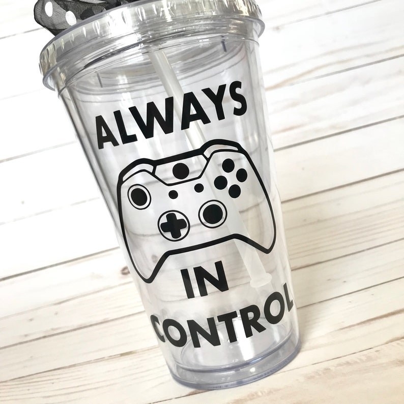 a clear tumbler cup with a controller on it and the words &quot;in control&quot;