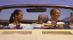 gif of three people driving in a car dancing