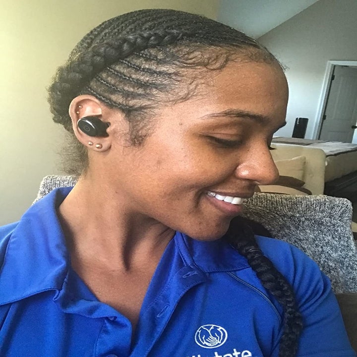 Reviewer wearing product in ear