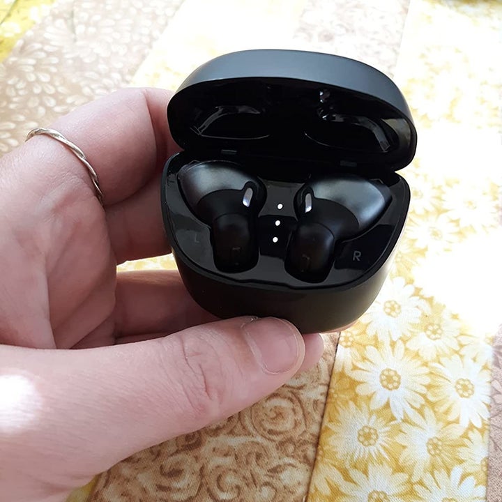 Reviewer holding product inside case