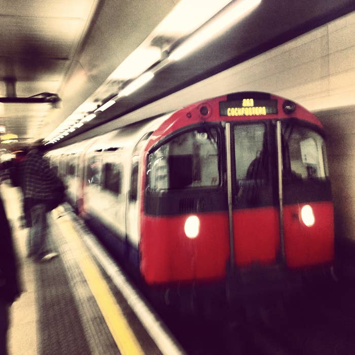 A London Tube subway train pulling into a station