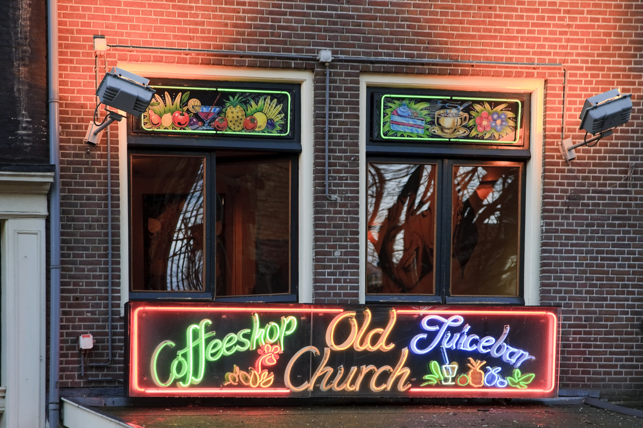A coffee shop with a neon sign