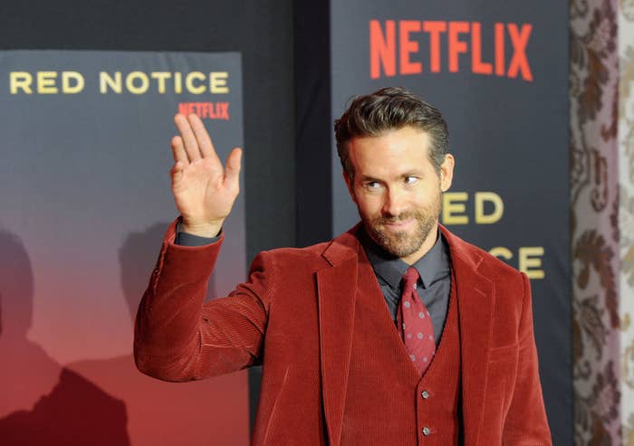 Ryan waving to the crowd at the premiere of Red Notice