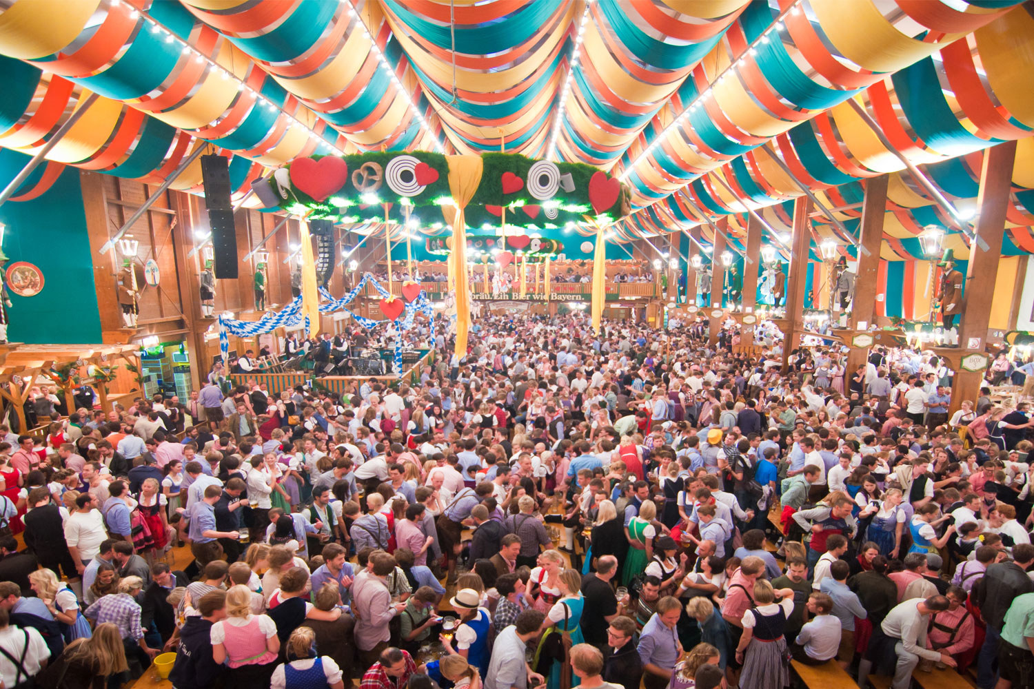 A colorful tent crowded with people