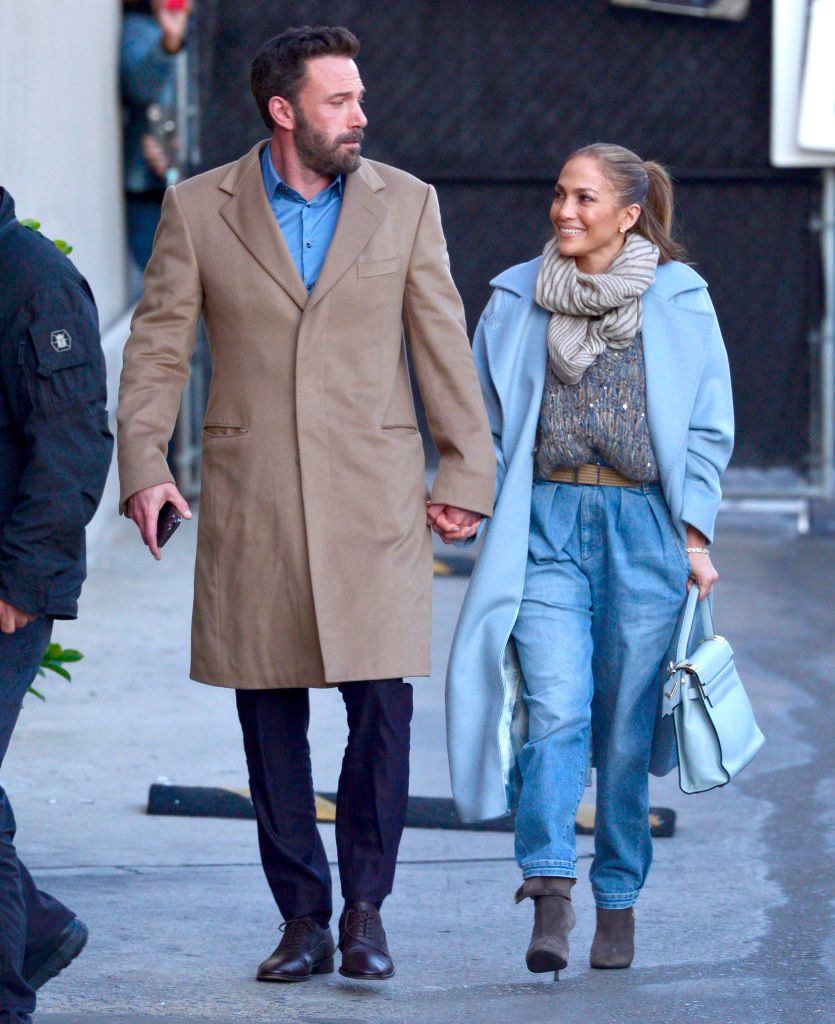 Ben and JLo holding hands as they walk down the street