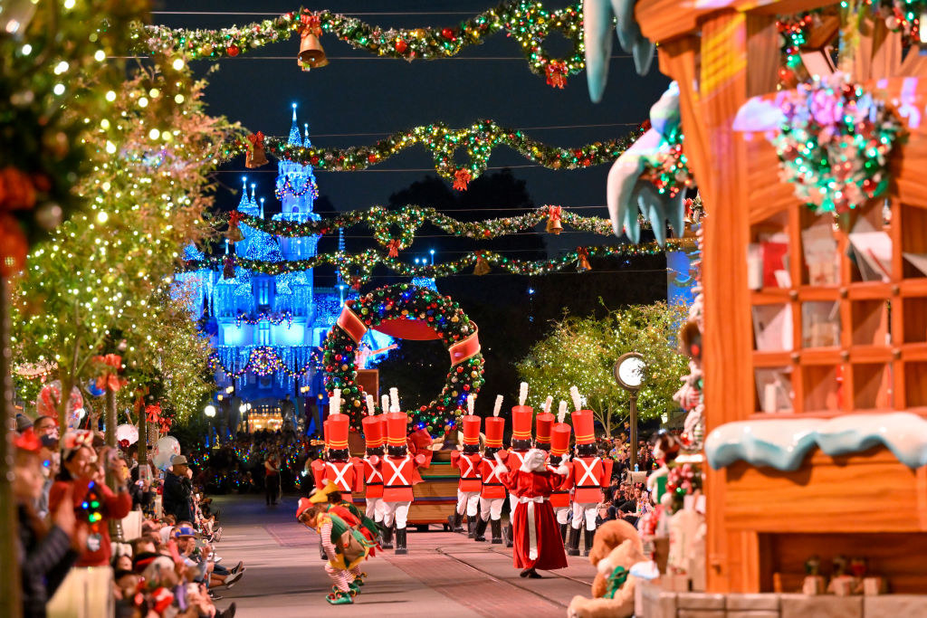 Visitors to Disneyland watch A Christmas Fantasy Parade during Disney Merriest Nites at Disneyland in Anaheim, CA