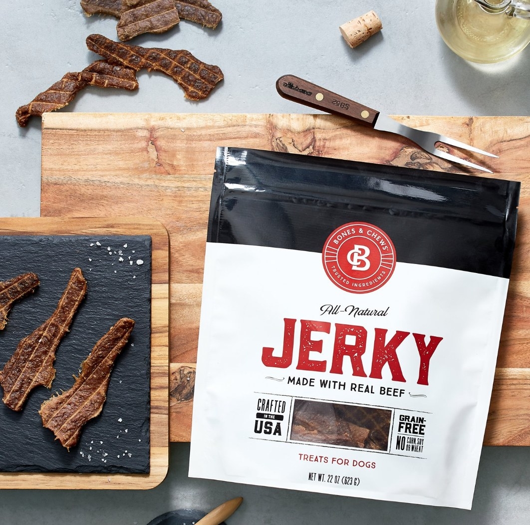 A white and red package of jerky with brown strips of jerky