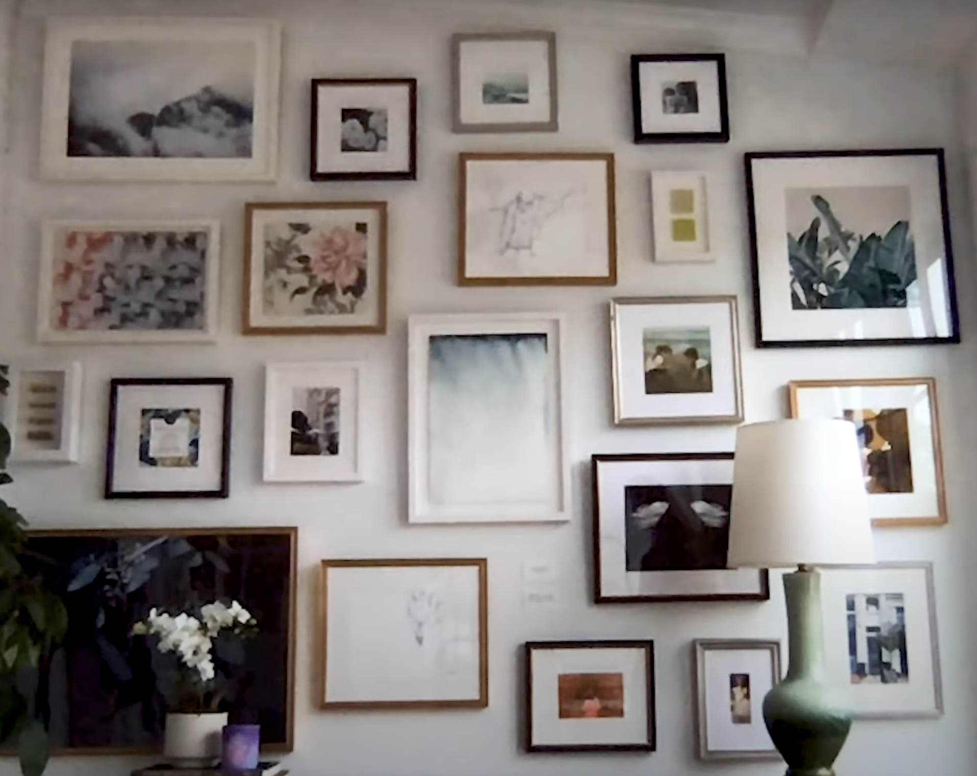 Large gallery wall against a white painted wall