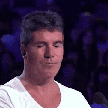 simon cowell laughing in shock