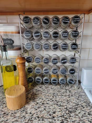 Two spice racks stacked with labels