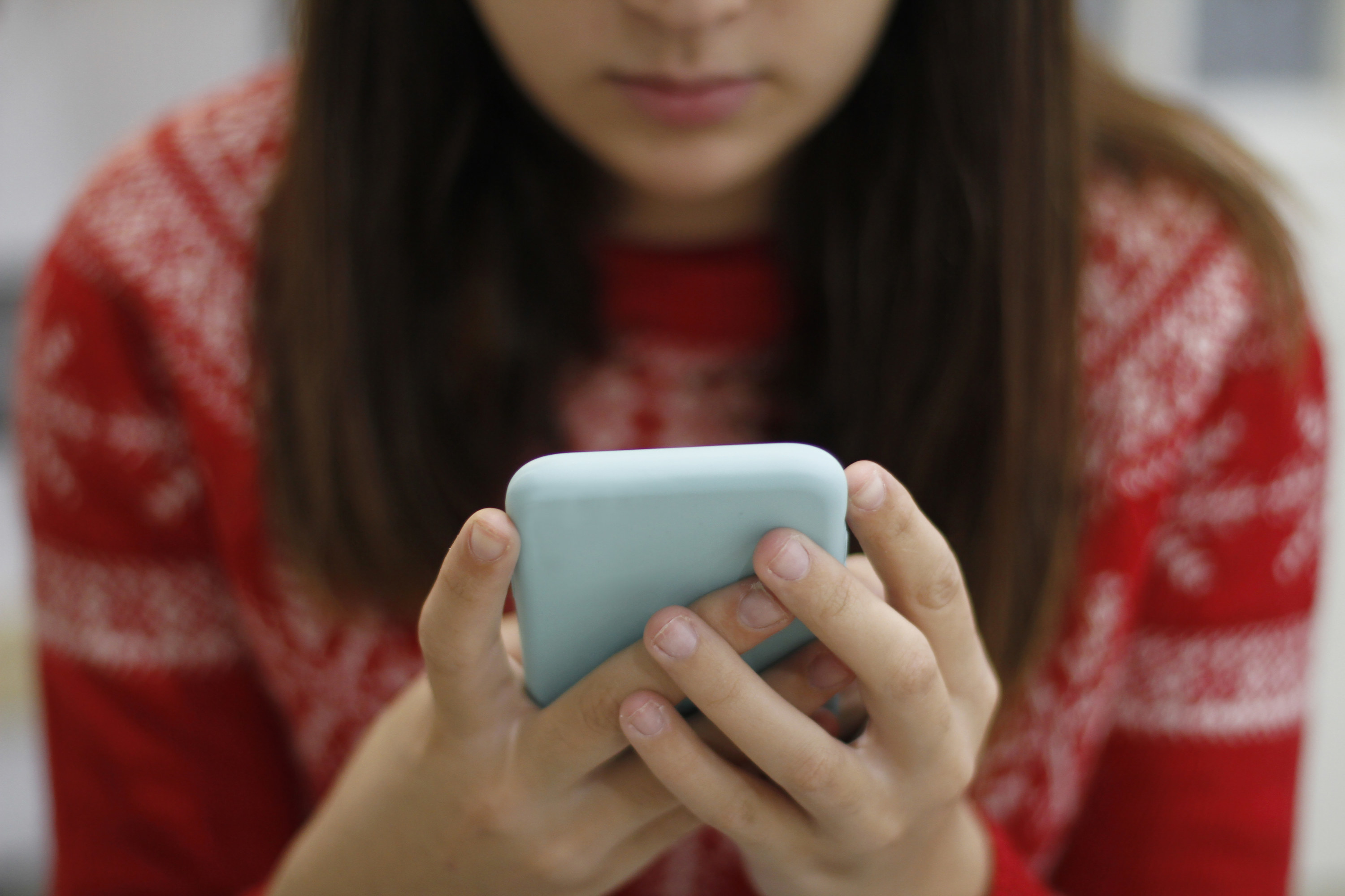 A woman looking at her cellphone