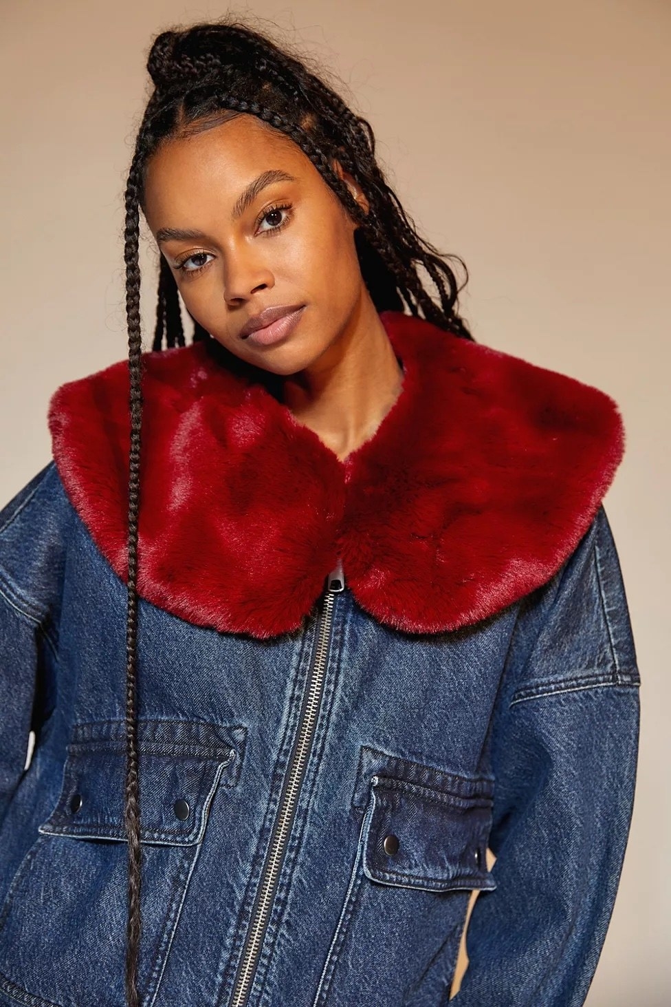 Model wearing the red collar over a denim jacket
