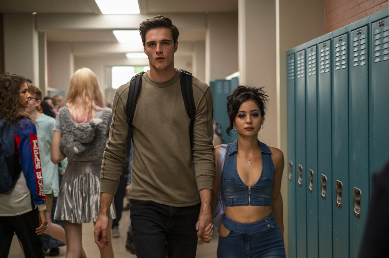Jacob&#x27;s character in Euphoria walking hand-in-hand with a girl down a school hallway