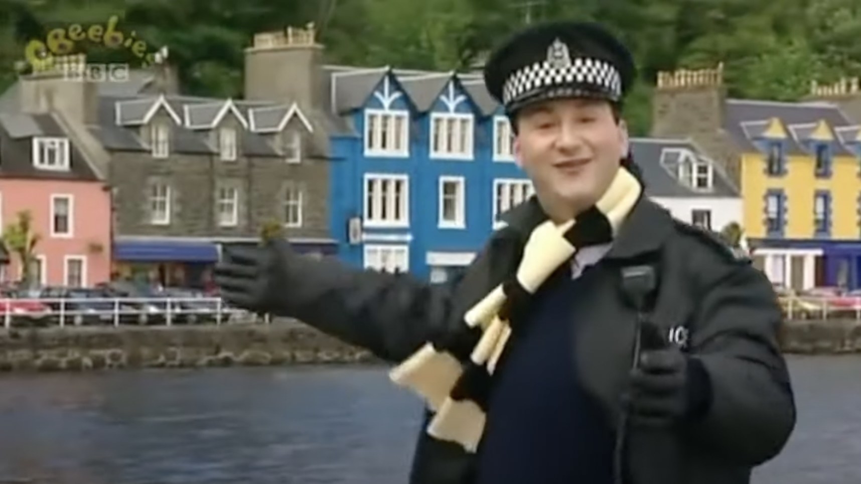 pc plum standing in front of the lake in balamory