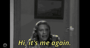 a gif of Kate McKinnon on &quot;Saturday Night Live&quot; coming through a door and saying &quot;hi, it&#x27;s me again.&quot;