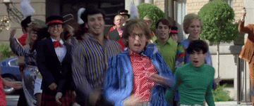 Mike Myers as Austin Powers dancing with a group of people