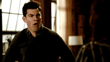 Schmidt from New Girl looking absolutely shocked and disgusted