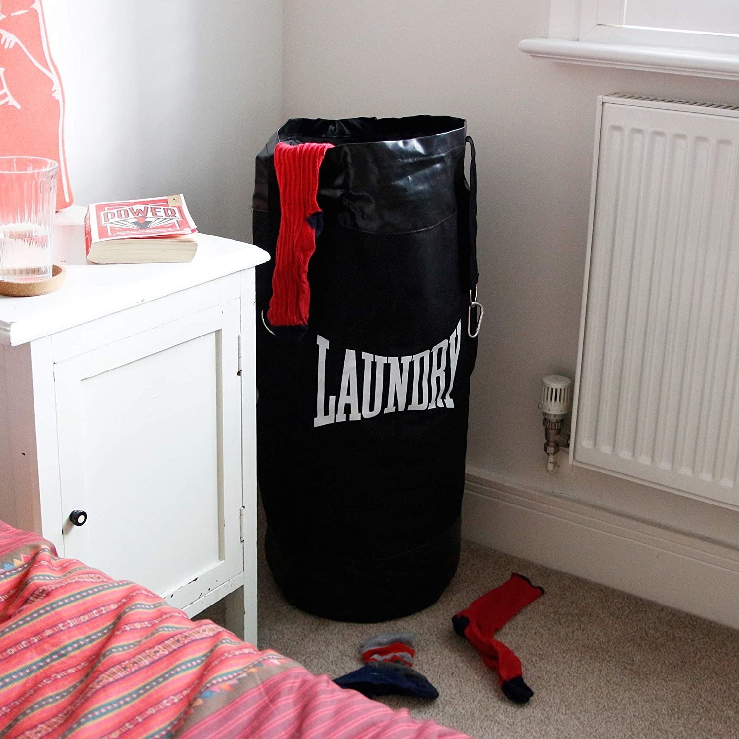 standing laundry bag that looks like a boxing punching bag