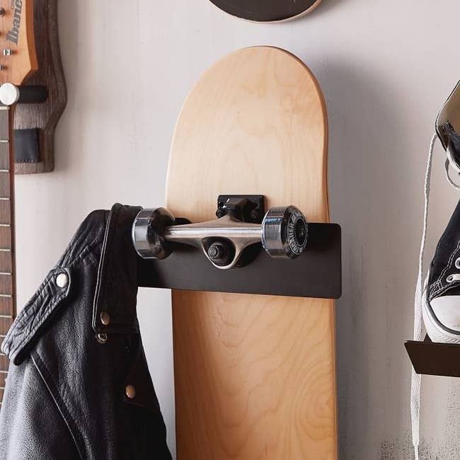 metal holder for a skateboard