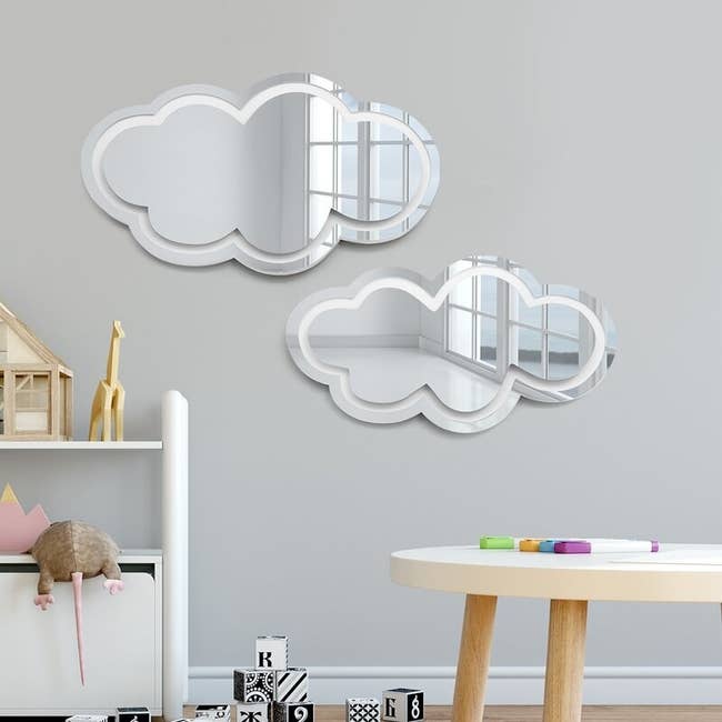 cloud shaped mirrors on wall