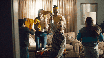 Family celebrating in living room