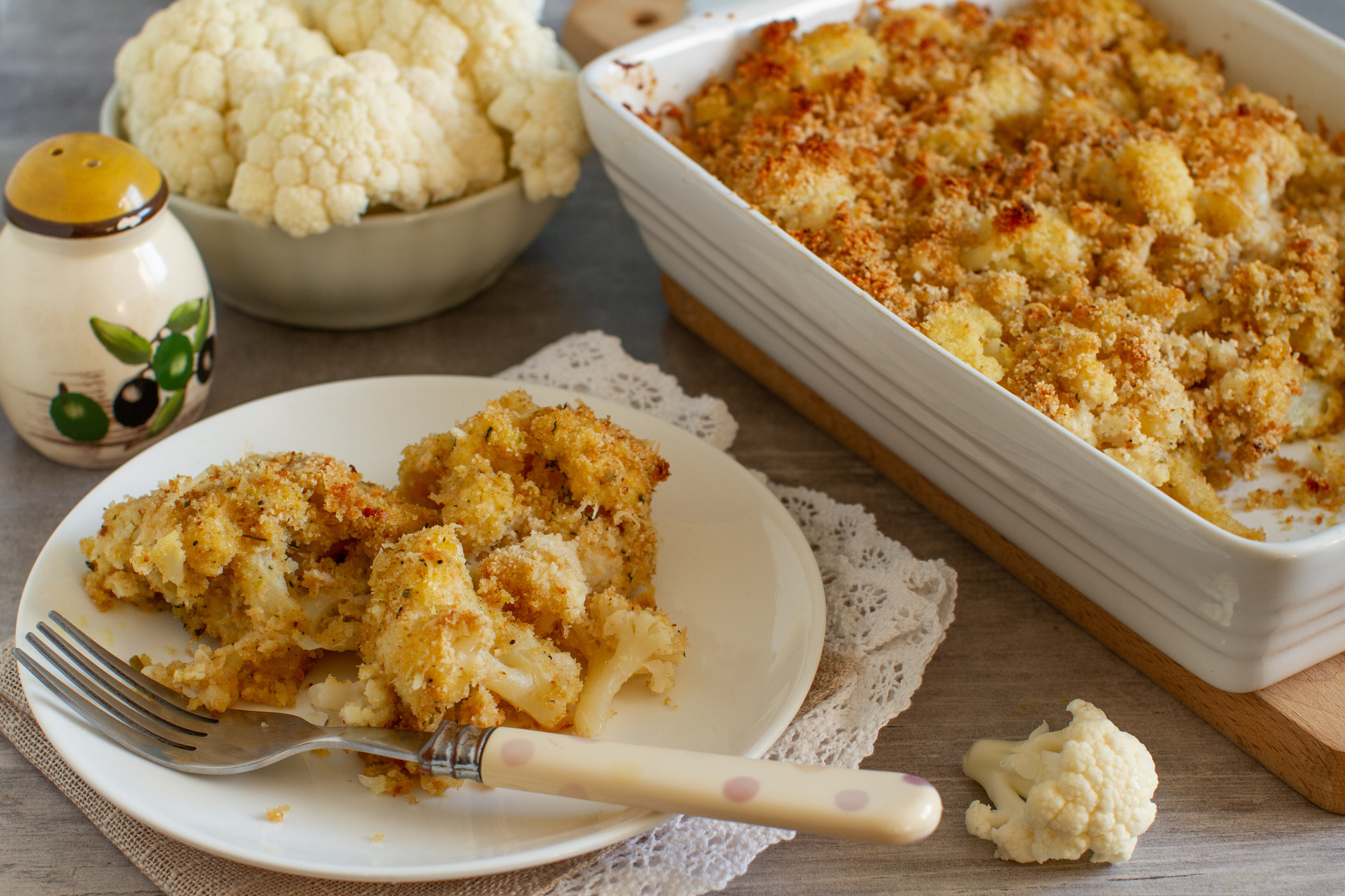 Roasted cauliflower with turmeric, peppers and breadcrumbs on a table