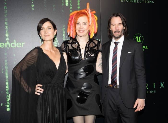 Carrie-Anne Moss, Lana Wachowski, and Keanu Reeves at a red carpet event