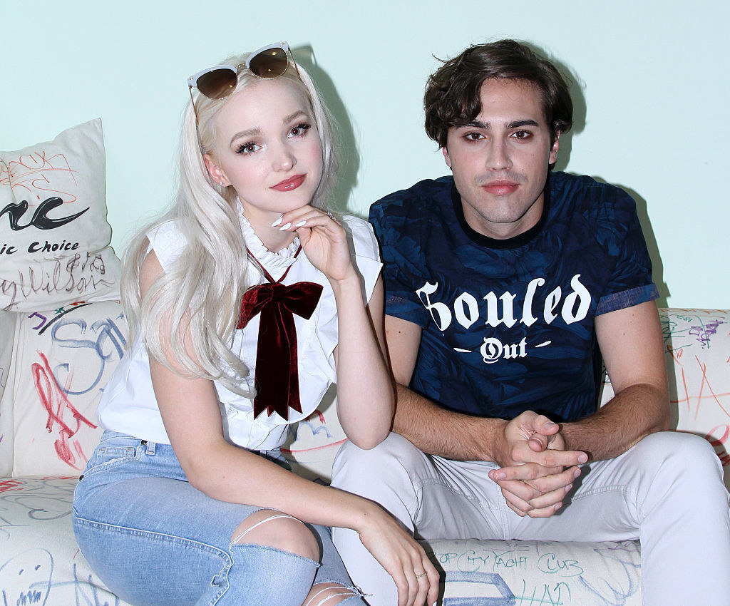 Dove and Ryan pose on a couch