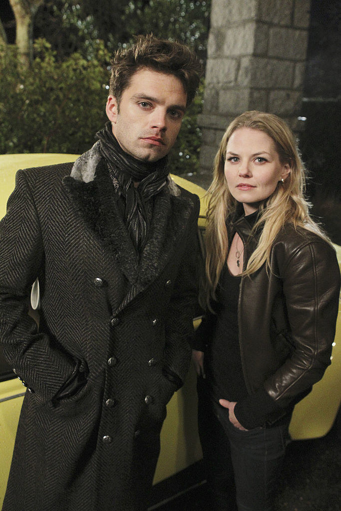 Emma Swan and the Mad Hatter stand by their bright car