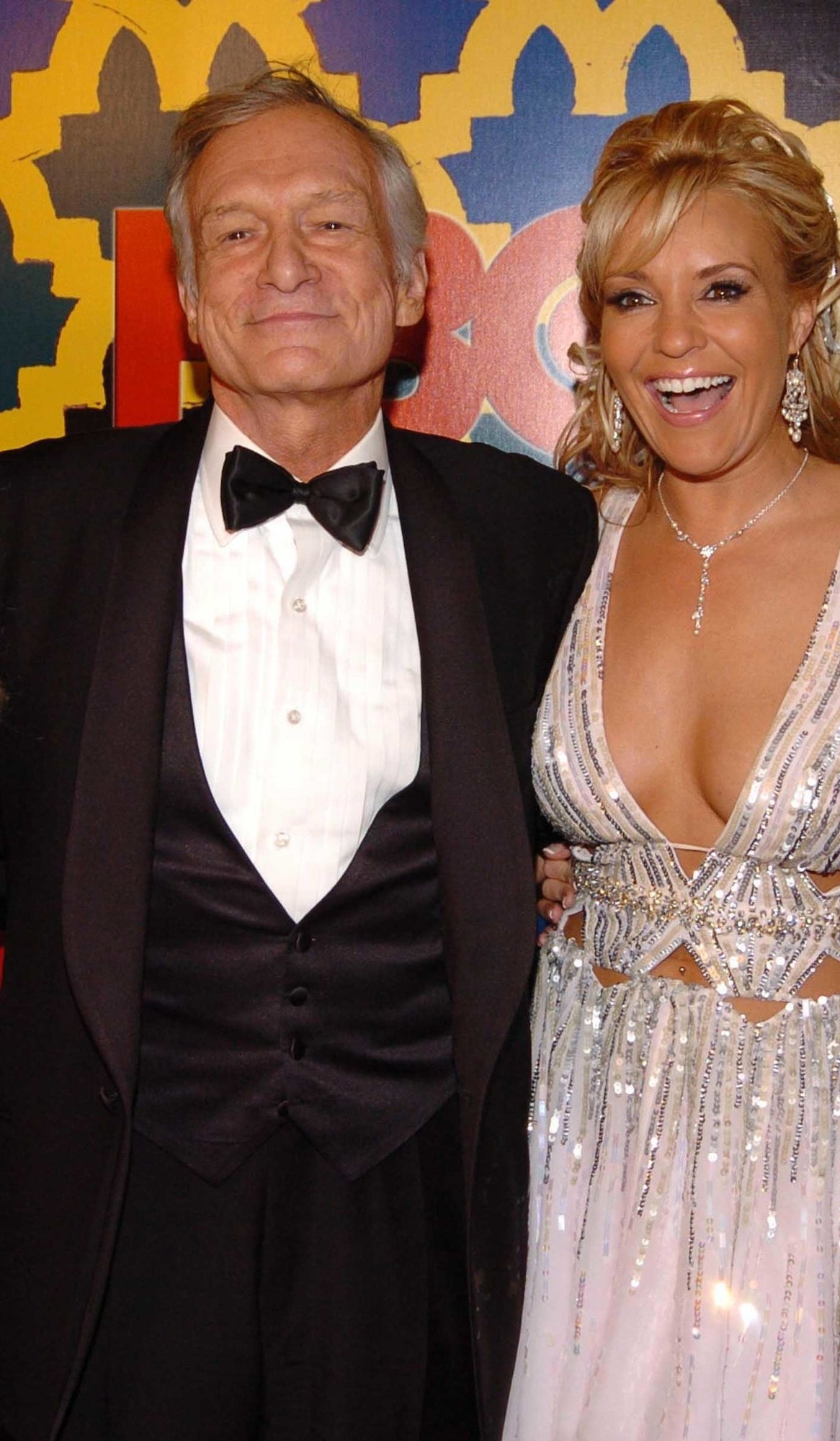 Hugh Hefner and Bridget Marquardt posing at an event