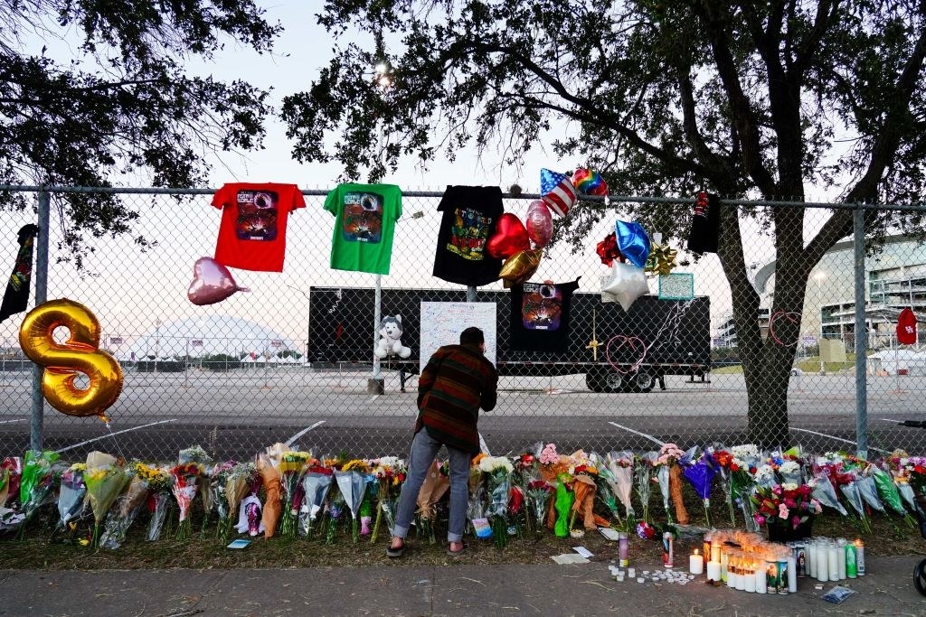 A makeshift memorial along a fence at the site of the incident