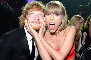 Taylor Swift makes a face for the camera as she holds Ed Sheeran's face