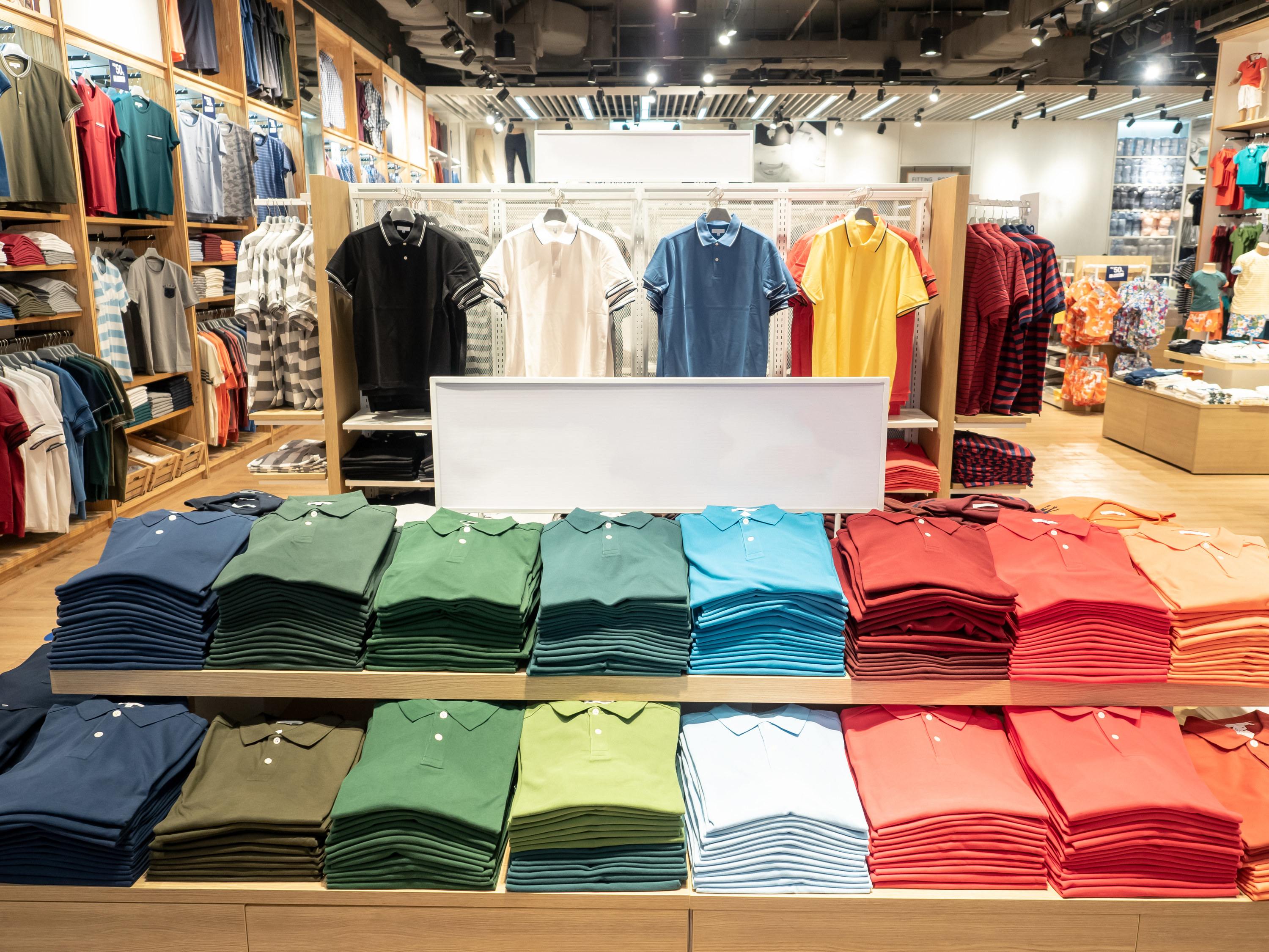 Folded polo shirts at a retail store