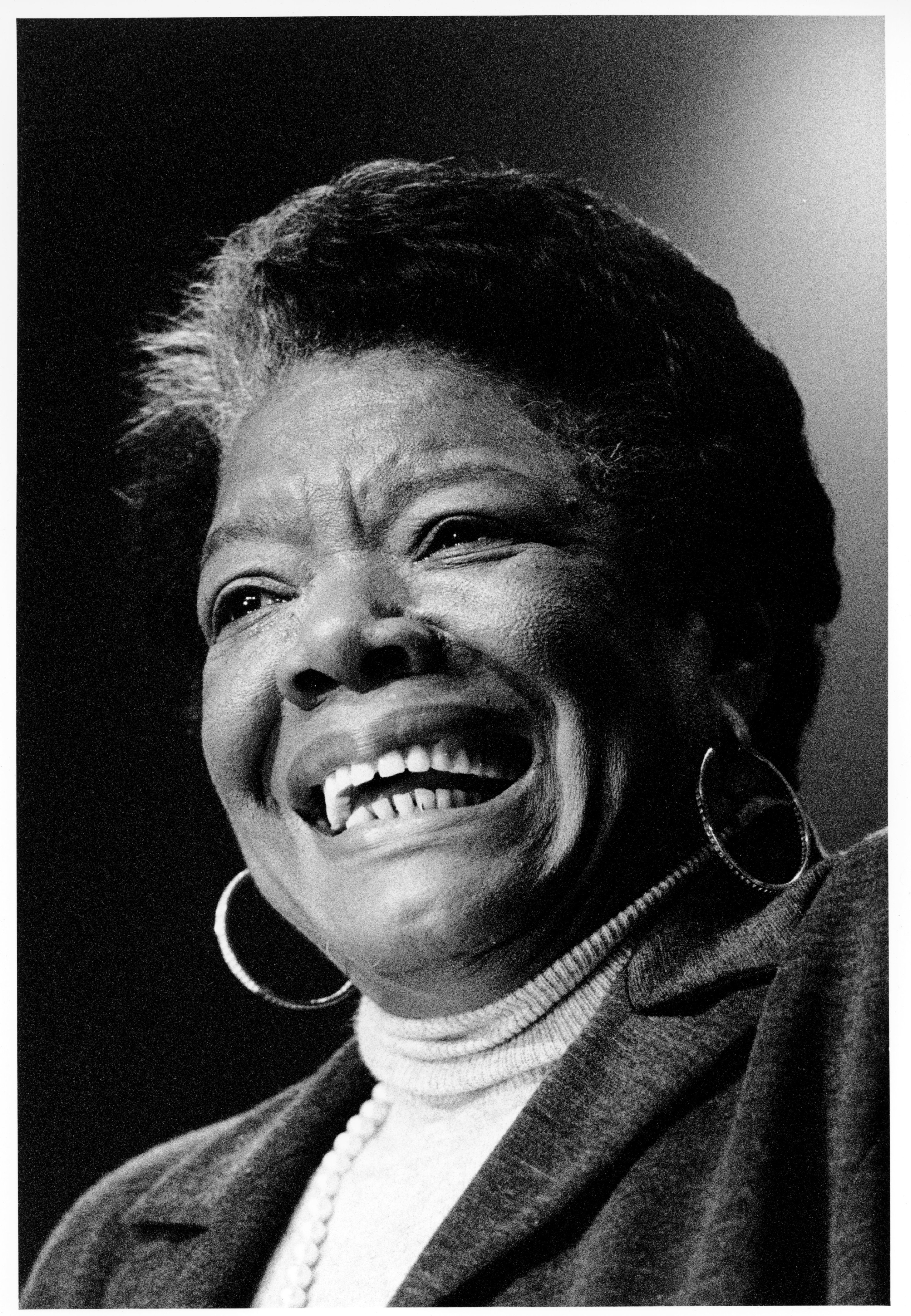 Maya Angelou smiles during a visit to Massachusetts for an event