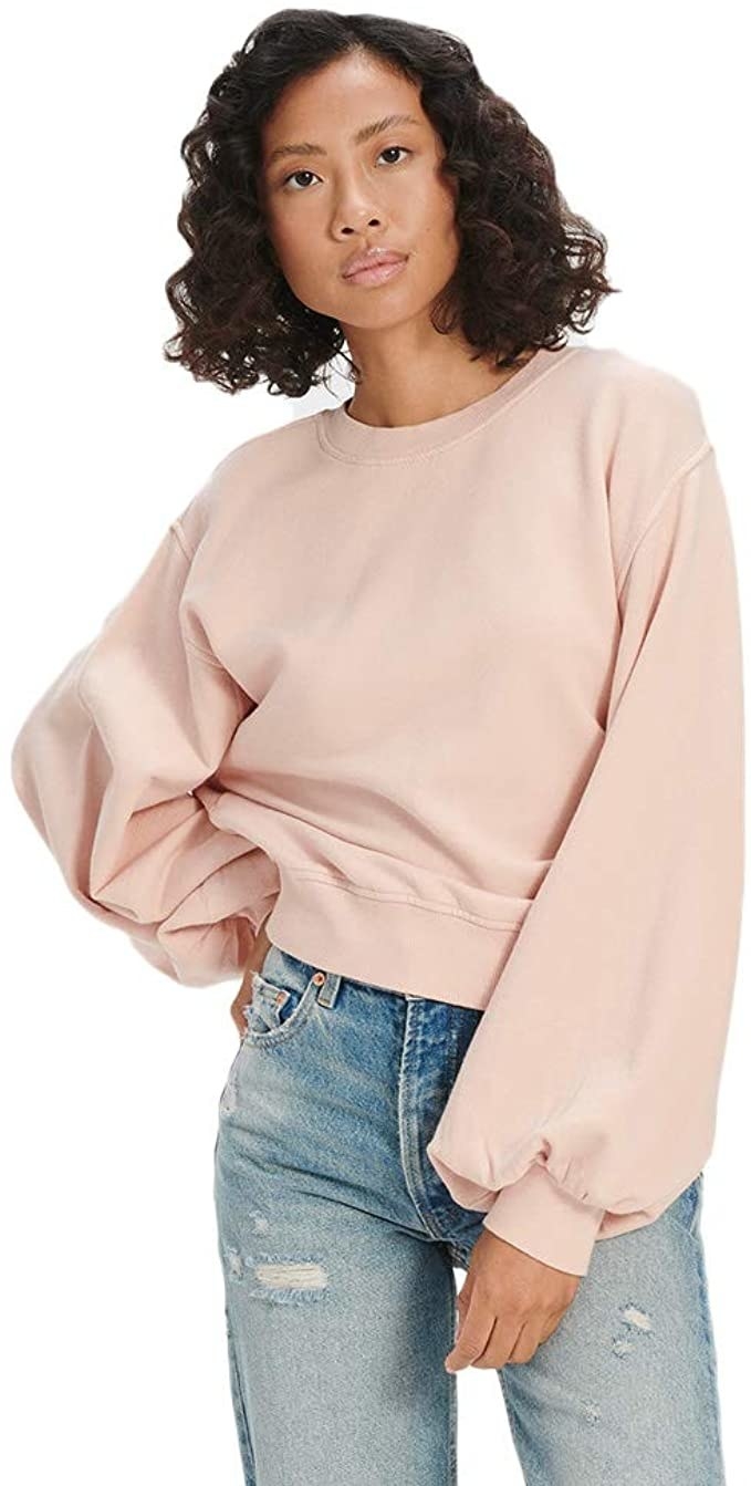 model wearing sweatshirt with balloon sleeves