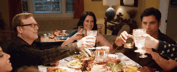 A family toasting at dinner