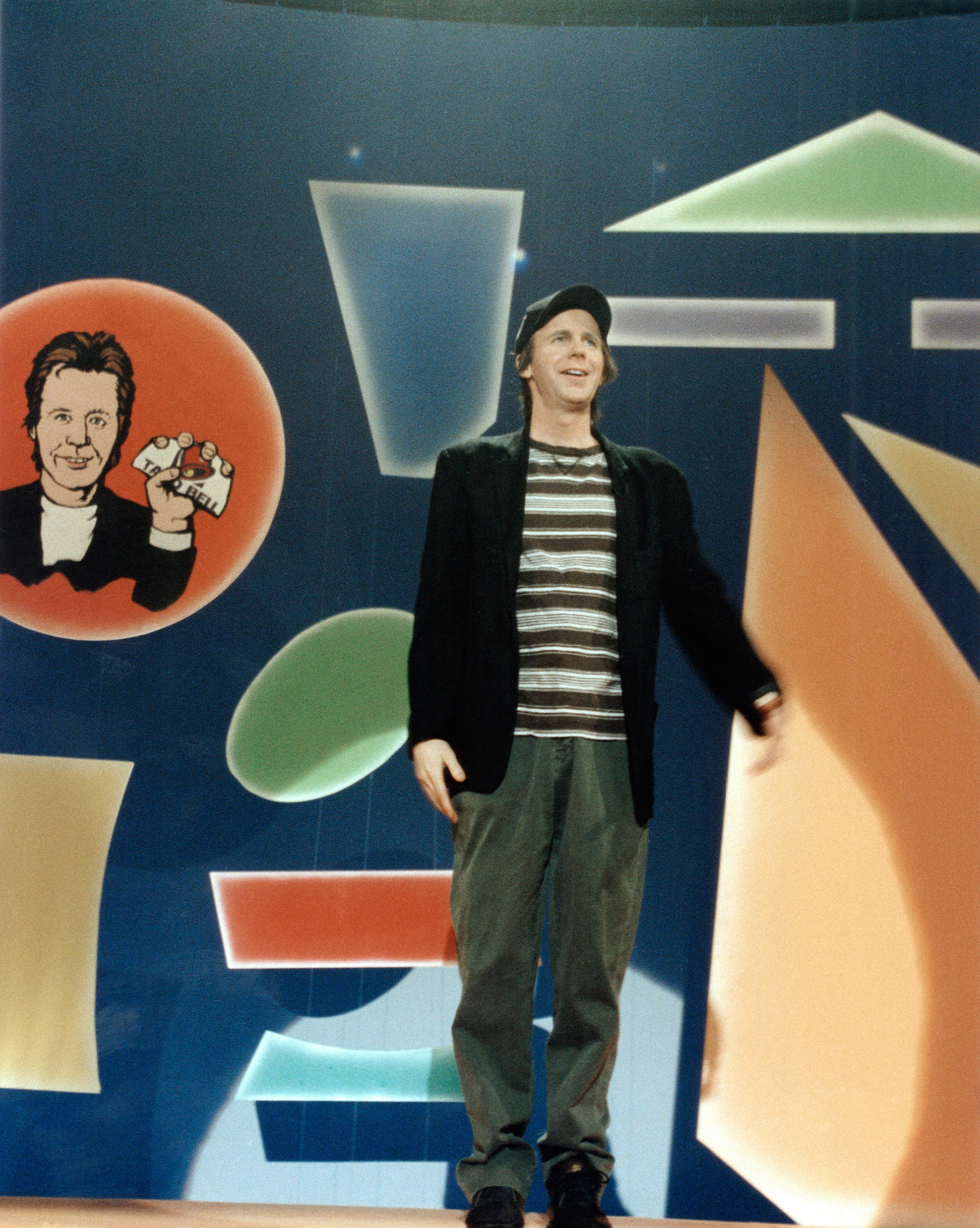 Dana Carvey on a stage on his show