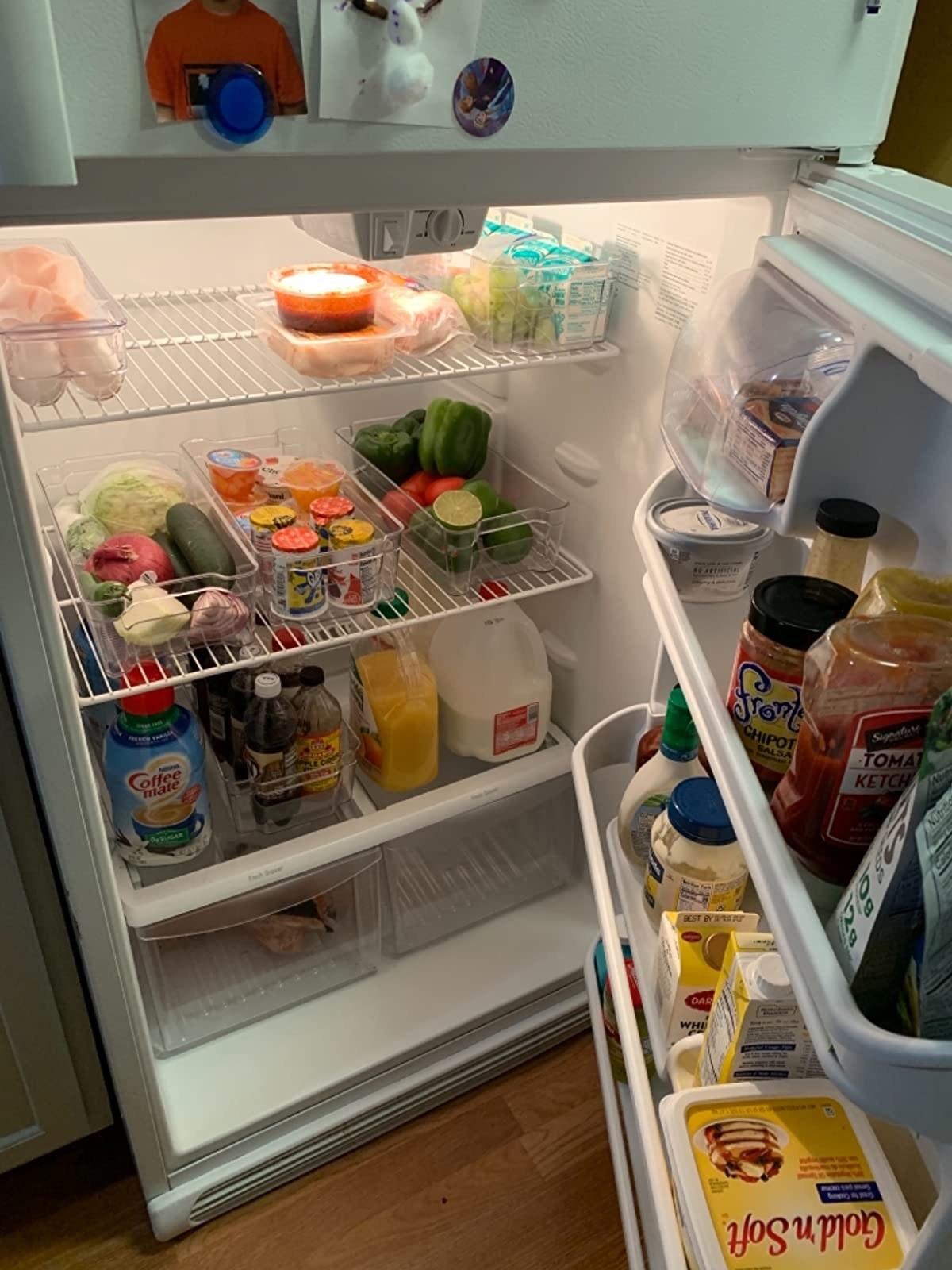 a reviewer's fridge with the organizational bins in it