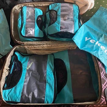 reviewer's packing cubes in a suitcase