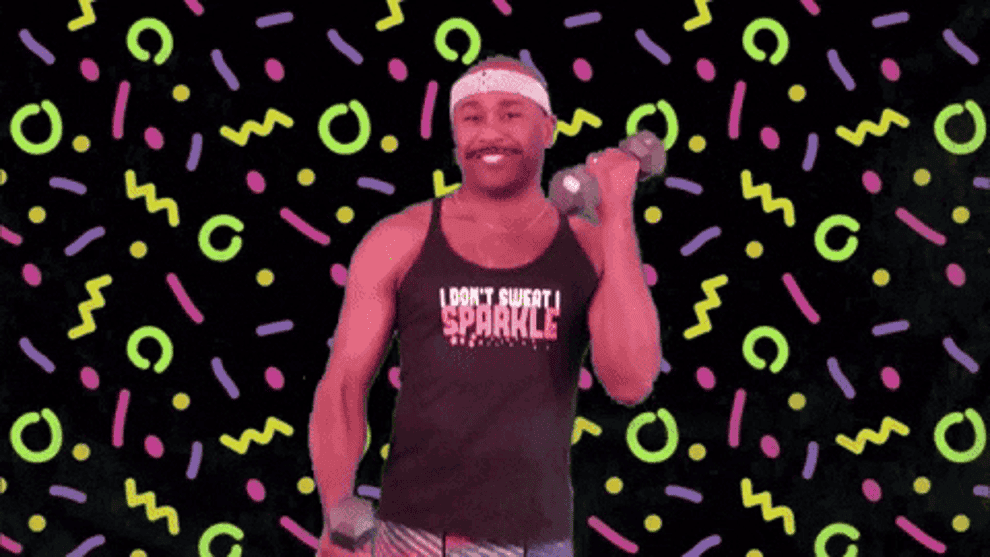 Happy man smiling in front of a neon retro background using arm weights