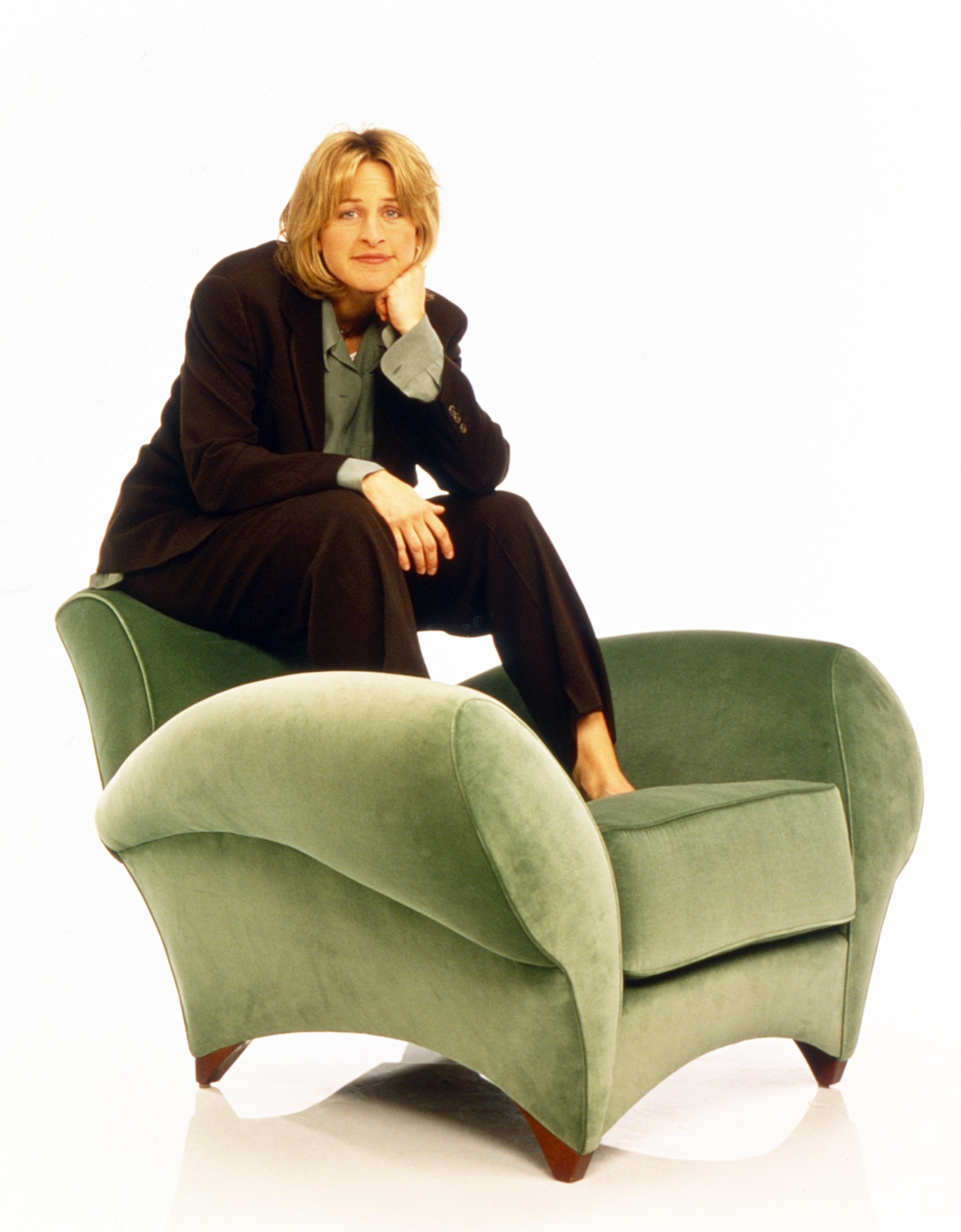Ellen sitting on a couch in a press photo for the show