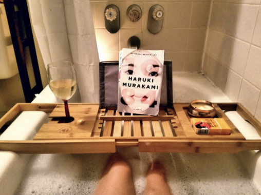 Reviewer in shower with bath caddy tray