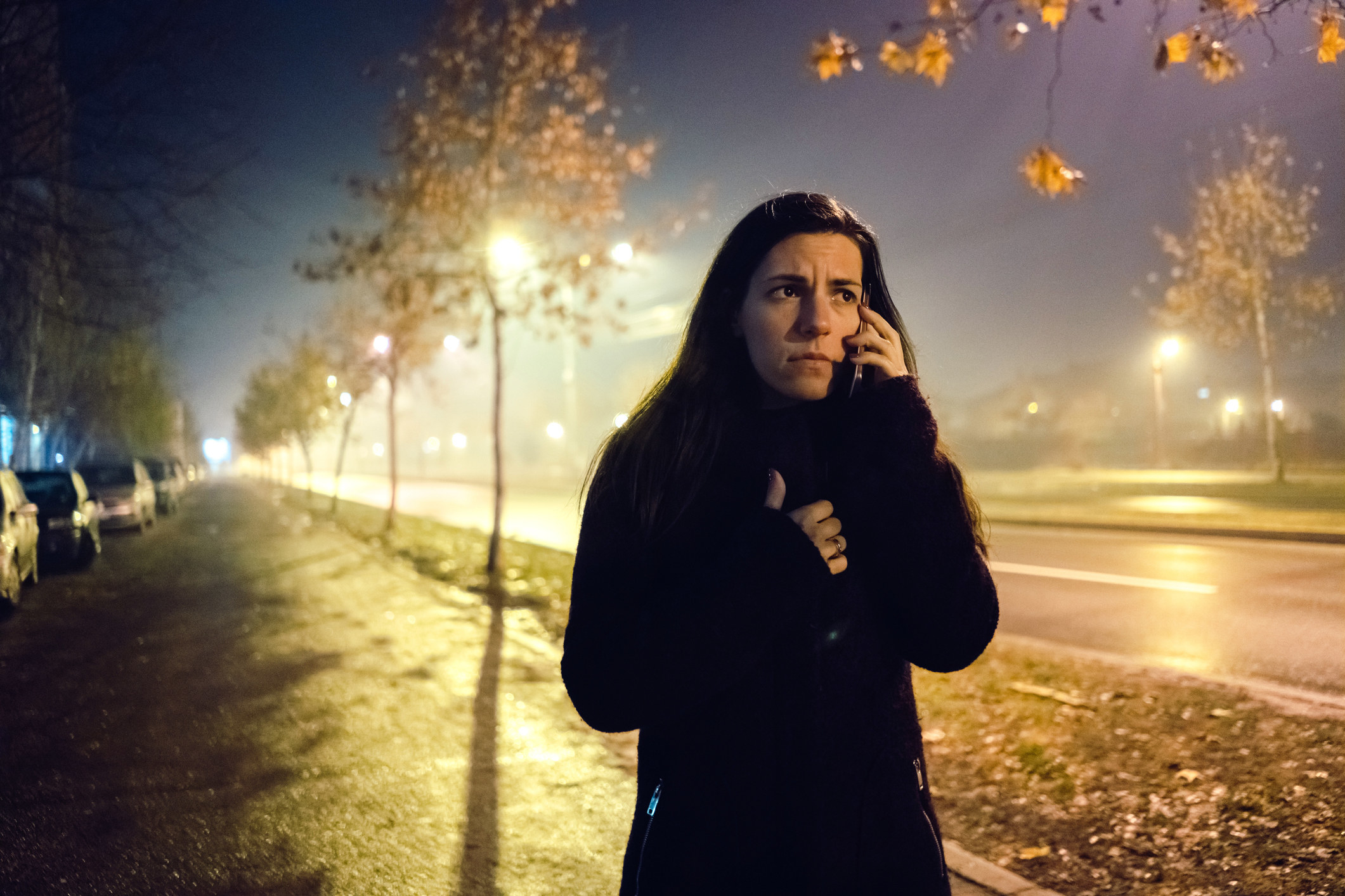 A woman on the phone while on a walk