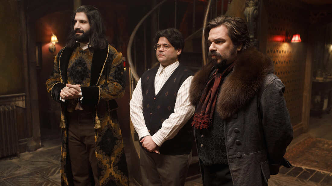 Protect Ya Neck: Nandor (Kayvan Novak), Guillermo (Harvey Guillen) and Laszlo (Matt Berry) receive visitors in the FX series &quot;What We Do In The Shadows&quot;