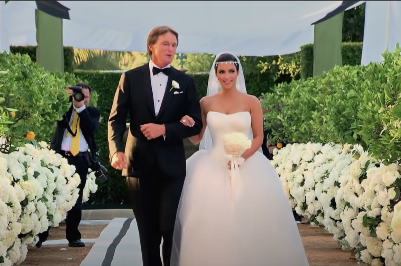 Kim walking with Caitlyn Jenner down the aisle