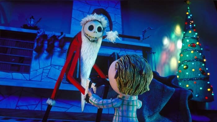 jack skellington dressed as father christmas giving a gift to a child in a nightmare before christmas