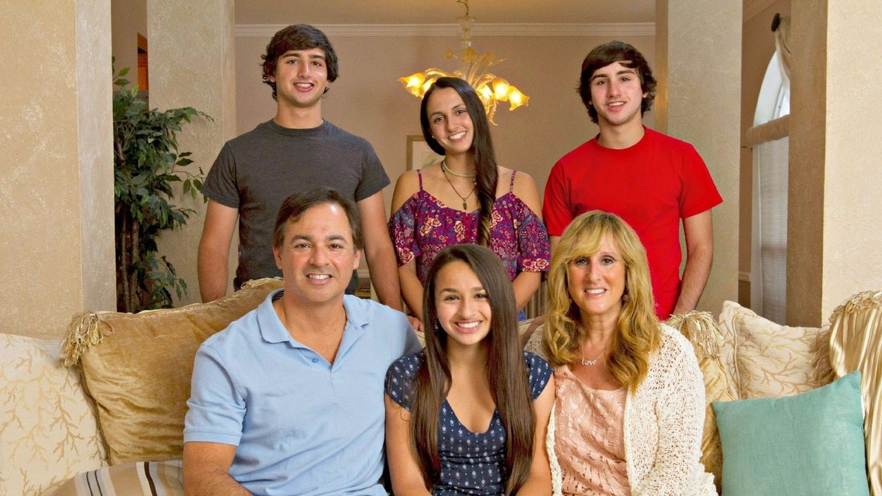 Jazz Jennings and her family sit on a couch together