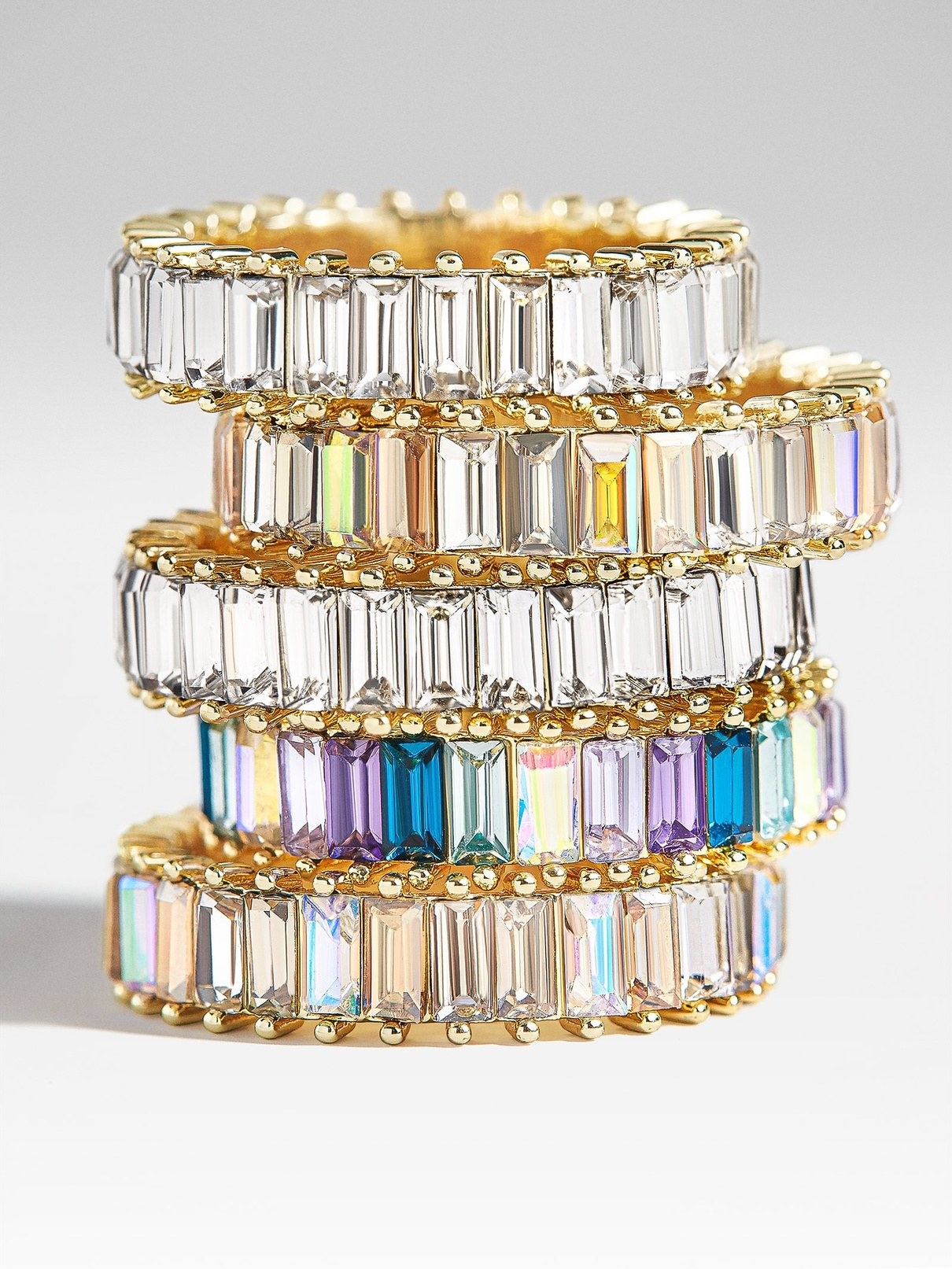 stack of rings with circle of baguette stones in various colors